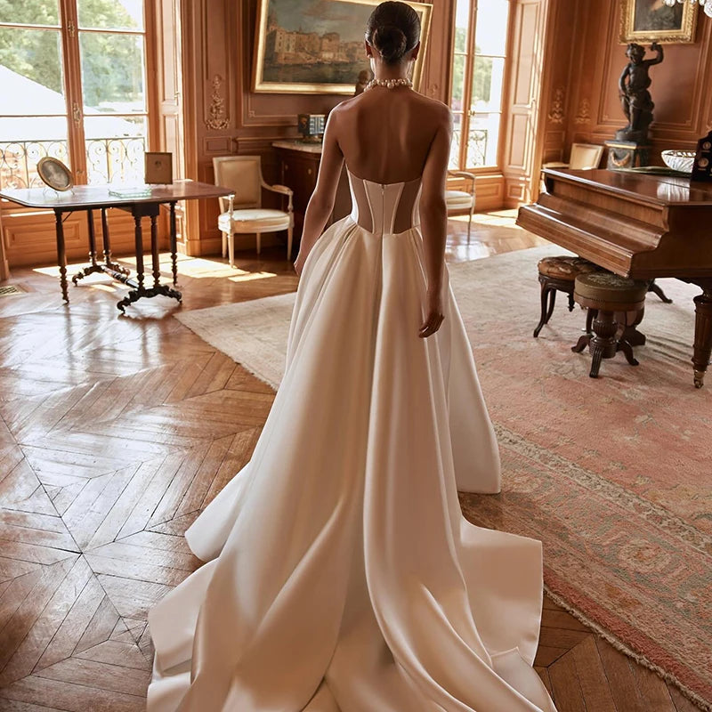 Satin wedding gown with removable long sleeves and structured fit