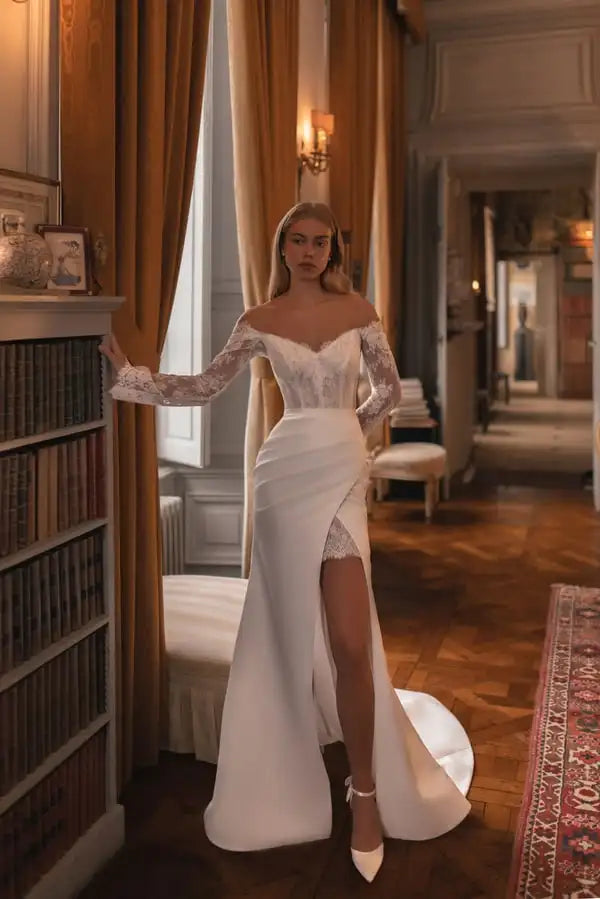 Mermaid bridal gown featuring sheer lace long sleeves and sculpted silhouette for formal weddings.