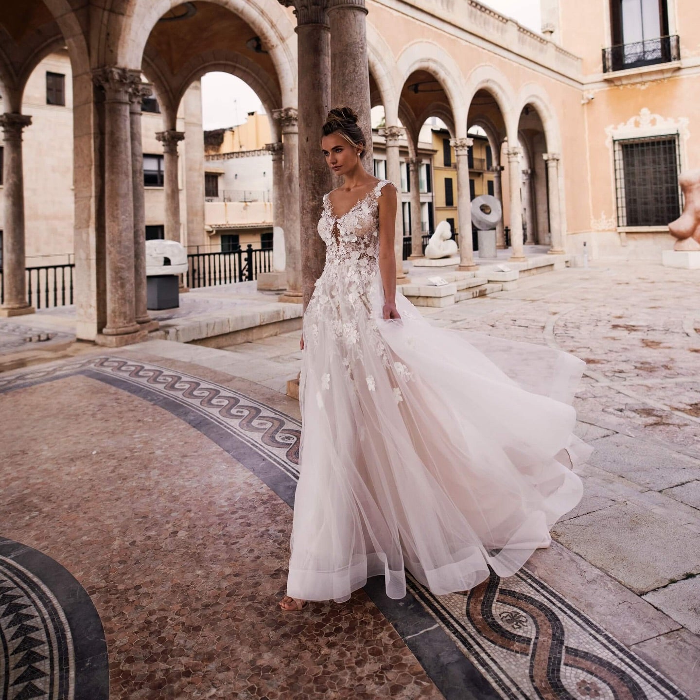 Boho A-line wedding dress with sheer floral bodice and cap sleeves