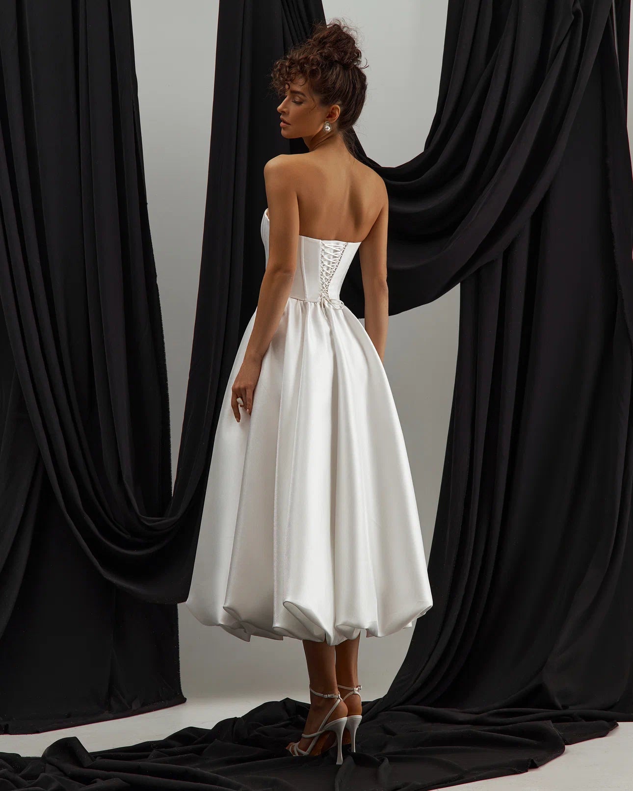 Stylish and modern bridal dress with satin finish and chic tea-length silhouette