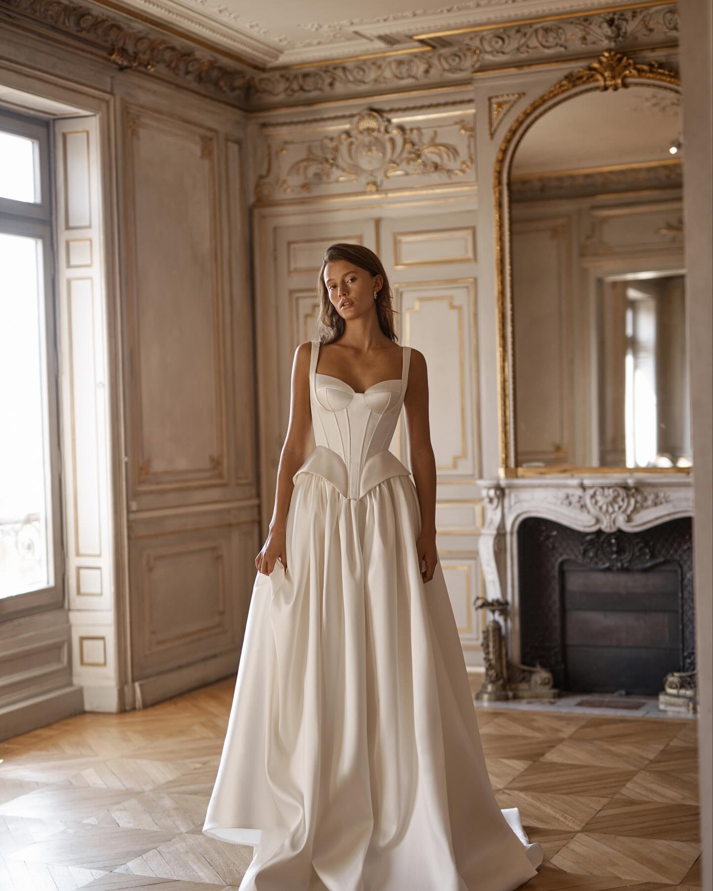 Elegant bridal gown featuring sweetheart bustier top and wide shoulder straps