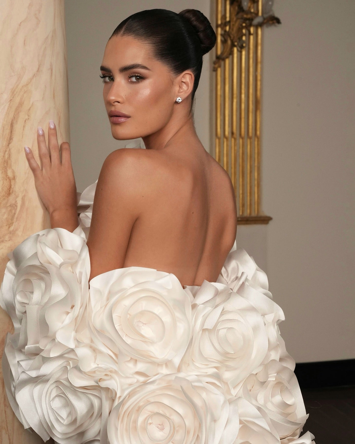Statement wedding dress with high slit and regal presence, handcrafted for timeless sophistication.