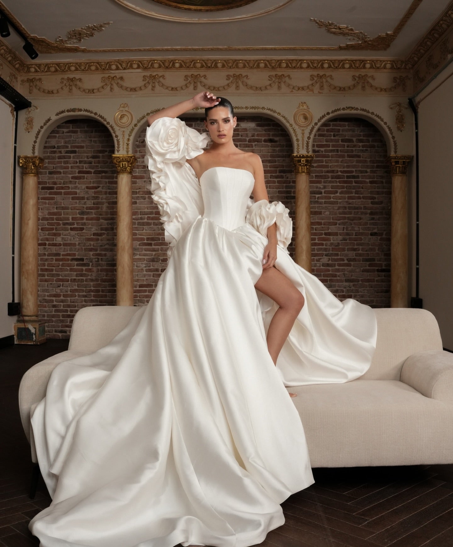 Luxurious bridal gown with off-the-shoulder detachable floral shawl and voluminous skirt perfect for formal ceremonies.