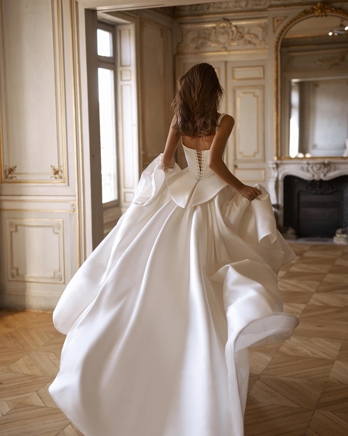 Sleek and modern wedding dress in ivory satin for luxury ceremonies
