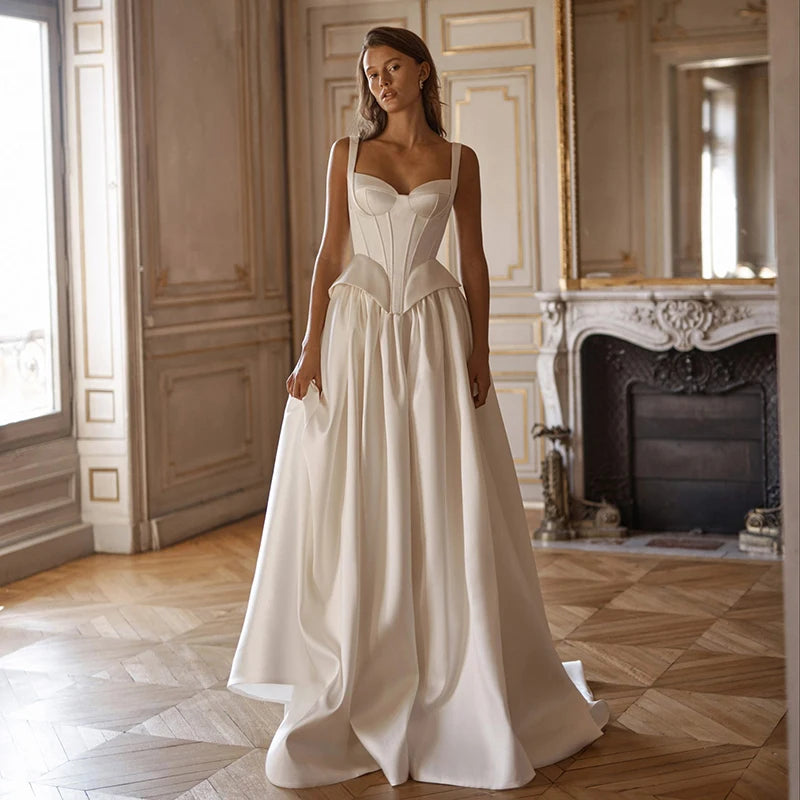 Modern white satin A-line wedding dress with structured corset and open lace-up back
