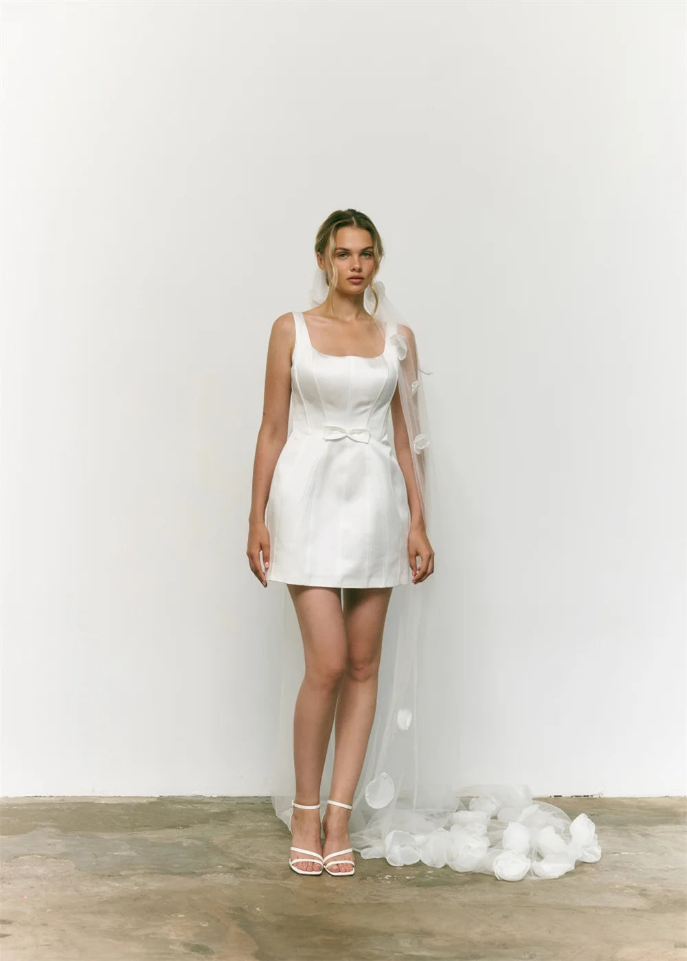 Back view of custom satin mini bridal gown with wide straps