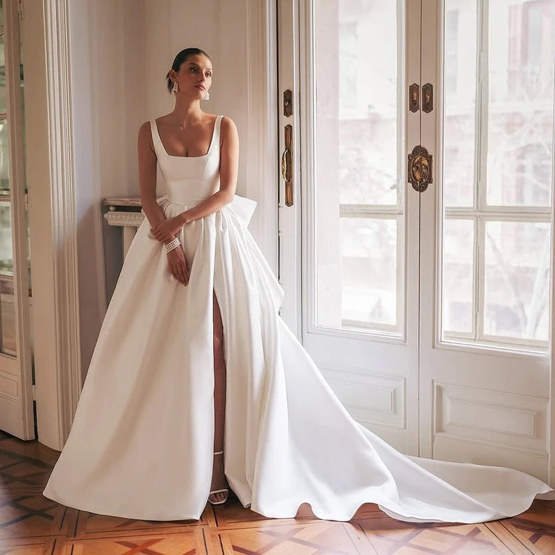 Elegant white satin A-line wedding dress with square neckline and sleeveless bodice