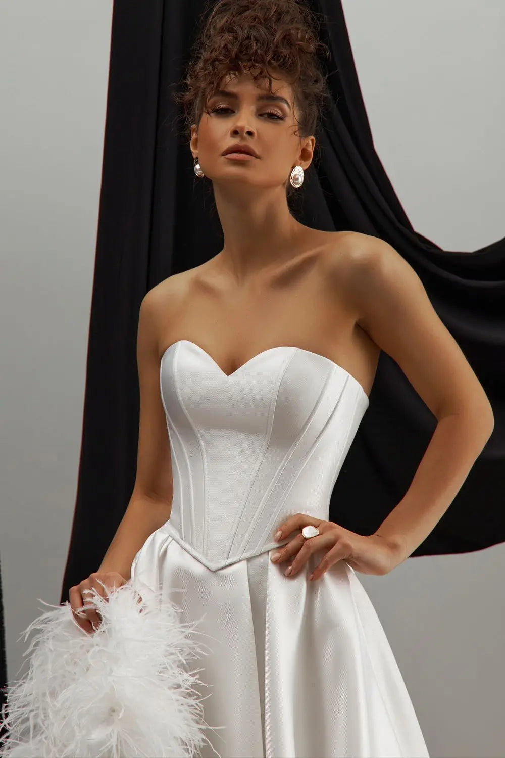 Custom-made short wedding dress with romantic corset top and unique hem design