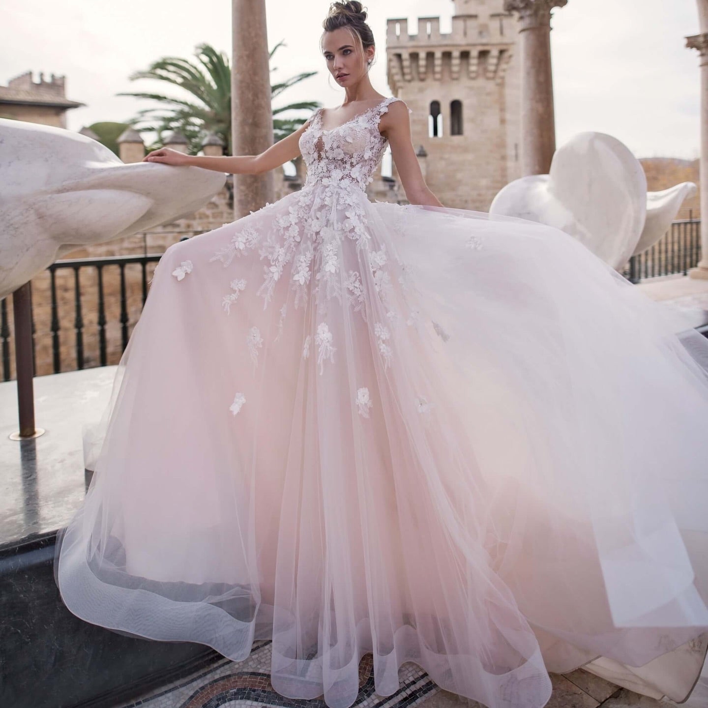 Romantic tulle bridal gown with illusion neckline and 3D appliqué
