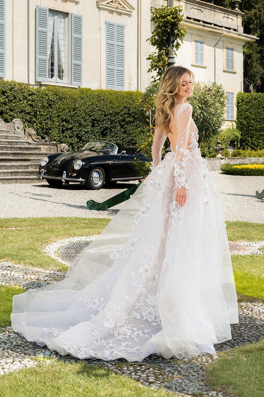 Romantic Ivory Tulle Wedding Dress With 3D Floral Lace, Deep V-Neckline, Long Sleeves, And Full, Flowing Skirt