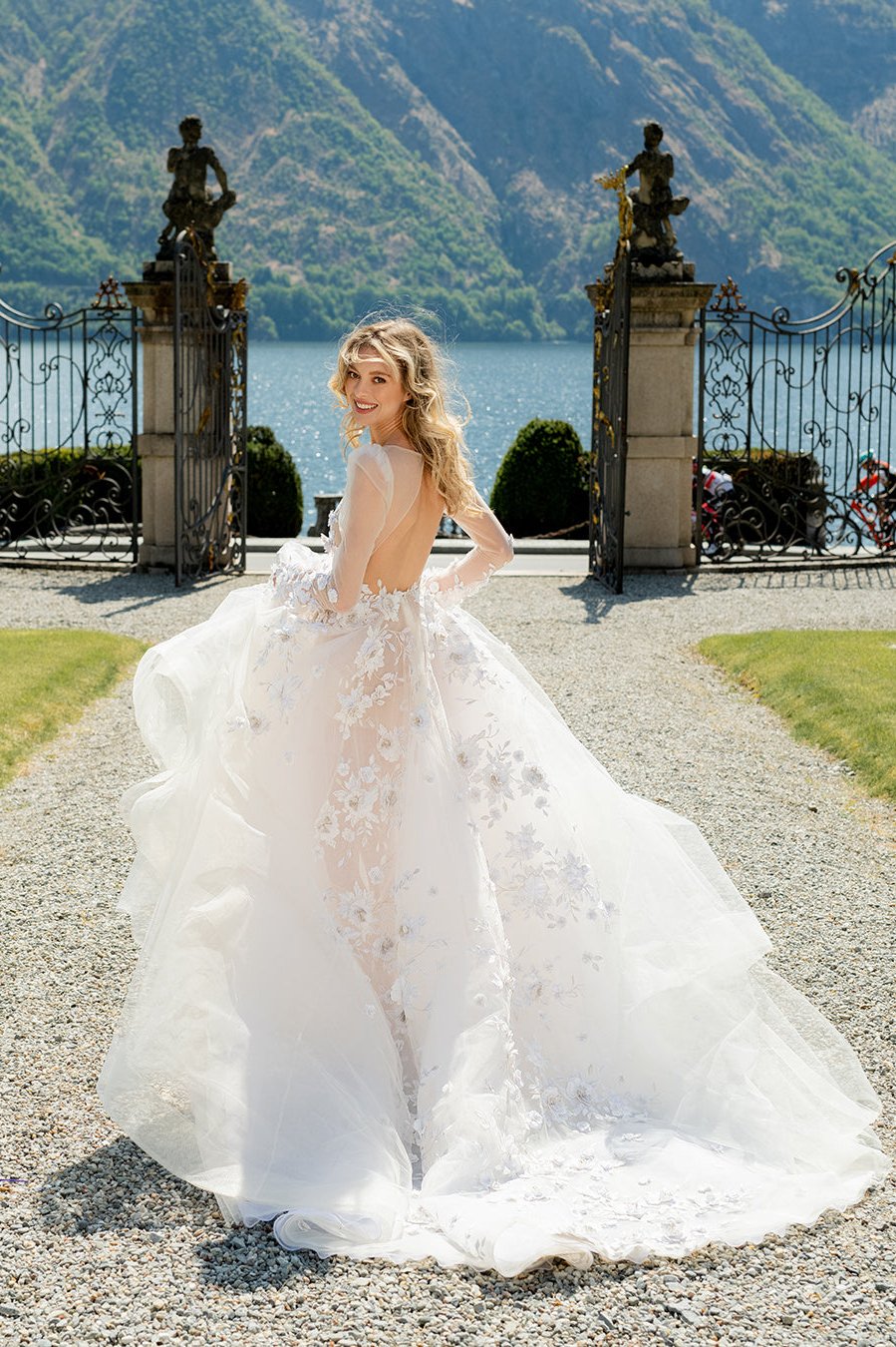 Romantic Ivory Tulle Wedding Dress With 3D Floral Lace, Deep V-Neckline, Long Sleeves, And Full, Flowing Skirt