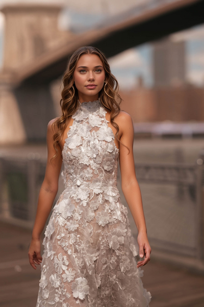 Elegant bridal gown featuring a halter neckline, sheer illusion bodice, and intricate floral appliqués.