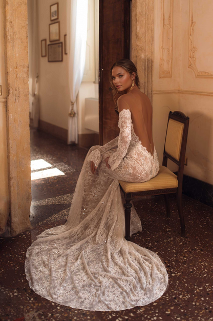 Elegant Long-Sleeve Lace Wedding Dress with Illusion Back & Flowing Train