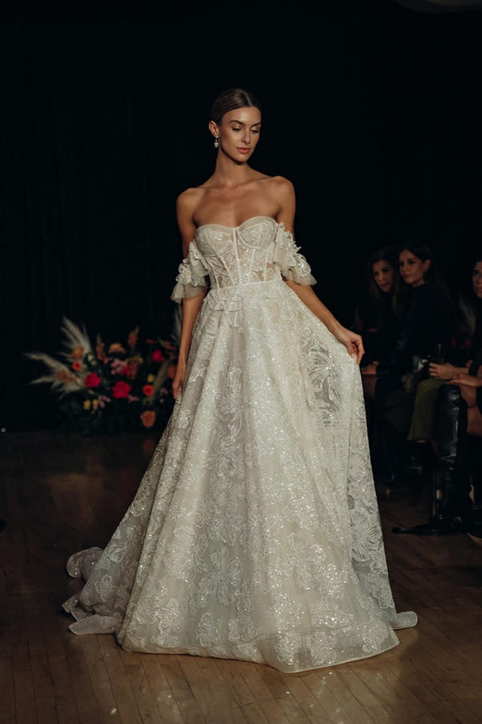 Angel-Inspired Off-White Floral Lace Bridal Gown With 3D Floral Accents, Sweetheart Neckline, Off-Shoulder Sleeves, And Light Flared Train