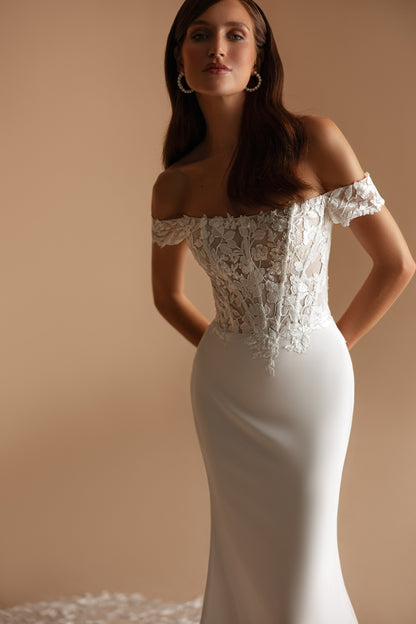 Back view showing buttons down the spine and minimalist train accent with 3D lace.