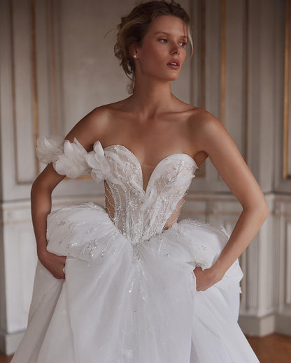 Luxury boho wedding dress featuring detachable off-shoulder sleeves and sequins