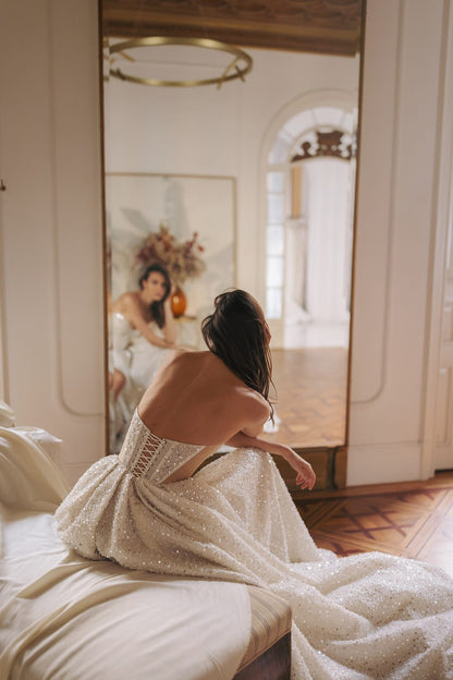 Back view of princess A-line wedding dress with lace-up corset and glitter details