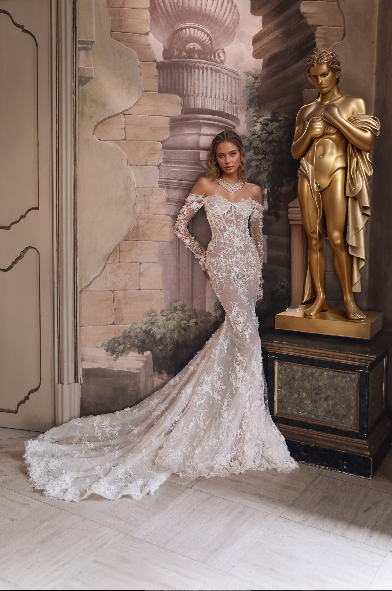 Romantic sheer lace wedding dress with illusion side cutouts and long dramatic train.