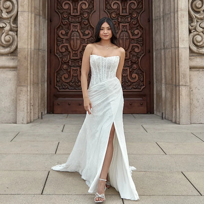 Full lace mermaid wedding dress with sweetheart neckline, structured corset and elegant side slit, designed for 2025 brides

