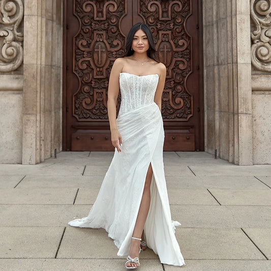 Full lace mermaid wedding dress with sweetheart neckline, structured corset and elegant side slit, designed for 2025 brides
