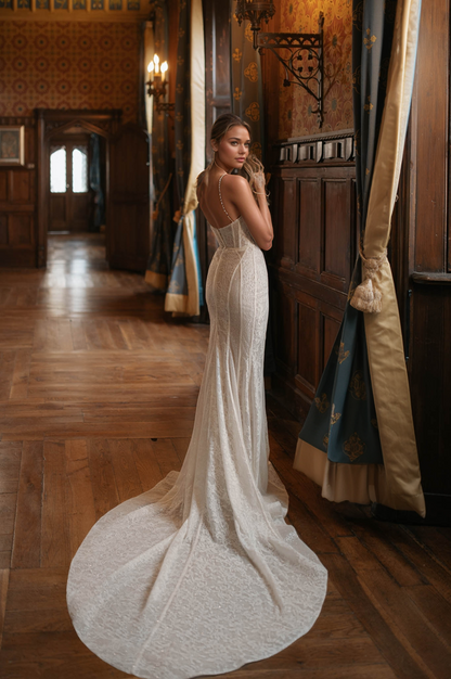 elegant strapless lace wedding dress with sweetheart neckline and long train in a luxurious interior