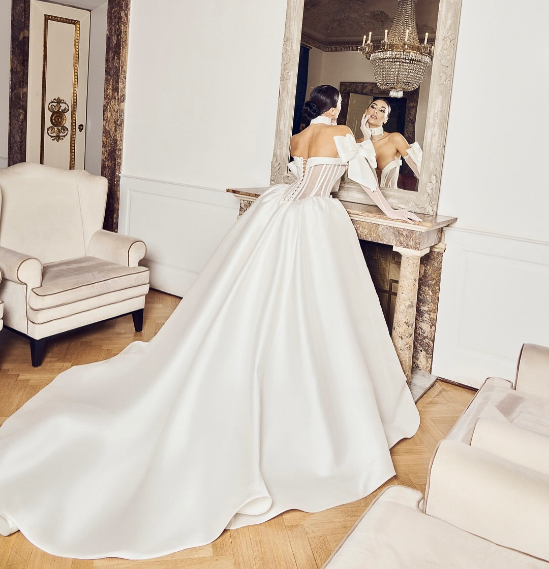 Cathedral train satin wedding gown with fashion-forward silhouette