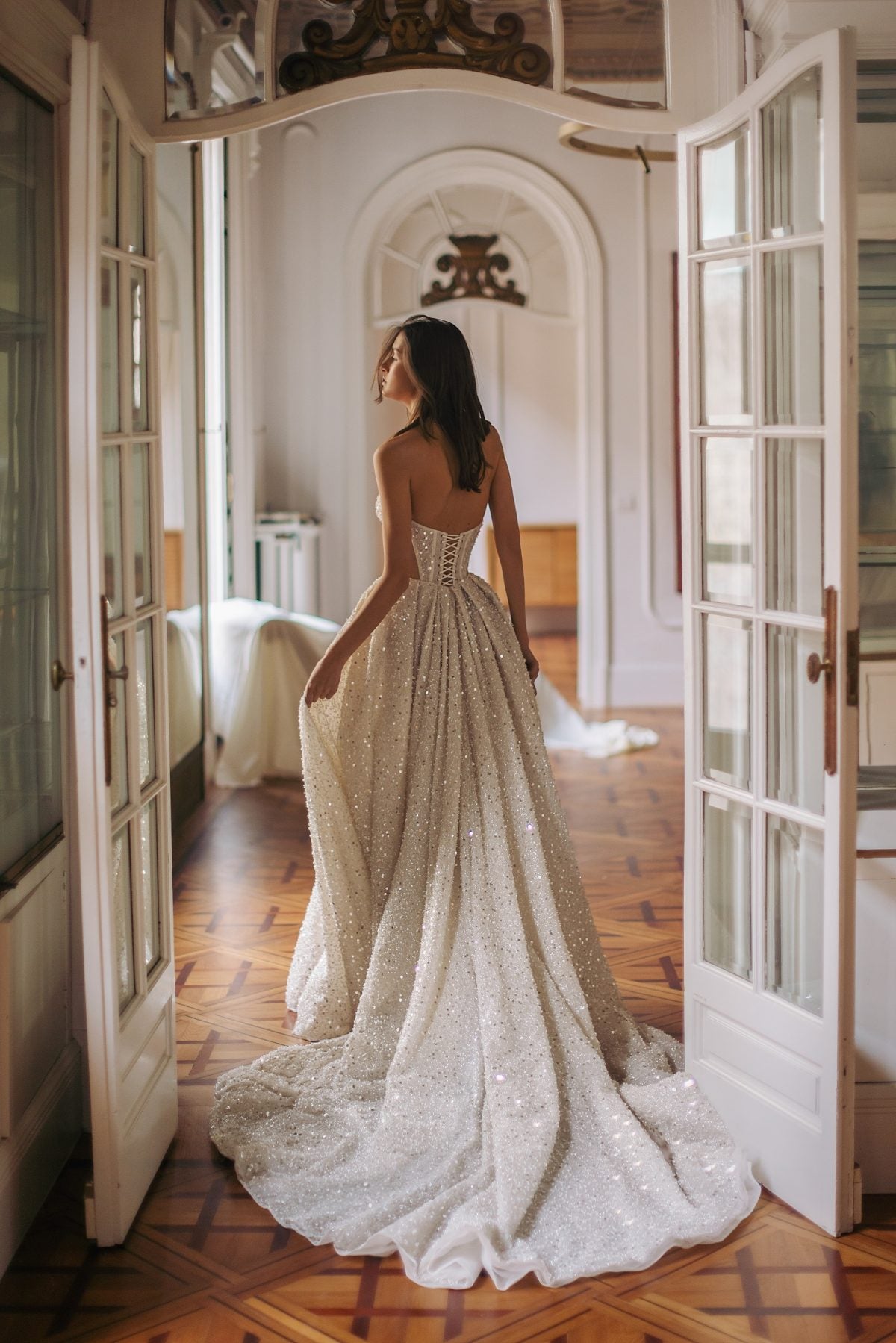 Luxurious bridal gown in shiny glitter tulle with bold front slit
