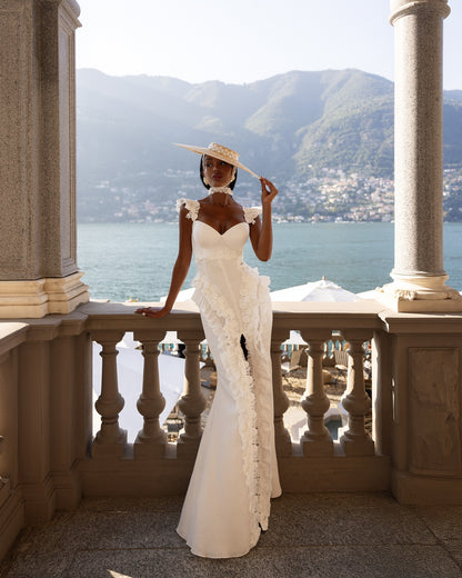 Mermaid wedding dress with sweetheart neckline and sculpted silhouette featuring front slit