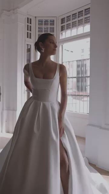 Custom-fit formal wedding gown in satin, perfect for contemporary and elegant weddings

