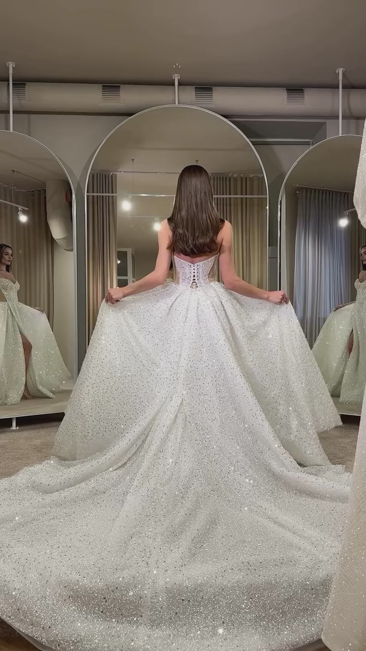 Bride in glamorous sequin wedding gown with sweetheart neckline and sparkle finish