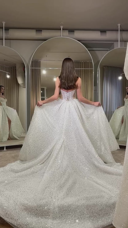 Bride in glamorous sequin wedding gown with sweetheart neckline and sparkle finish