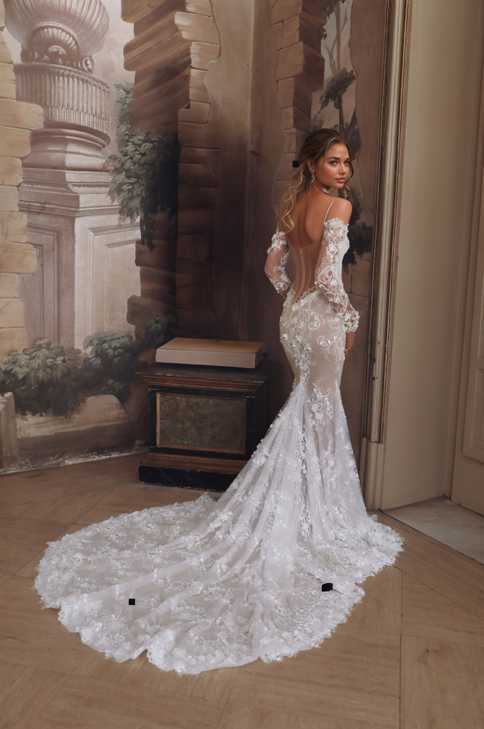 Sexy off-shoulder mermaid gown with intricate lace appliqués and form-fitting silhouette.