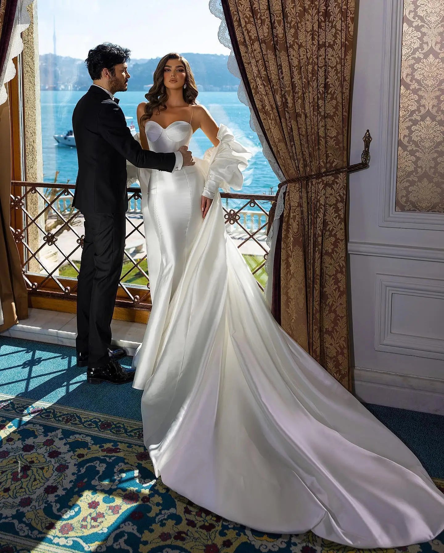Sleek and sexy mermaid gown made of smooth satin with luxury bridal vibes.