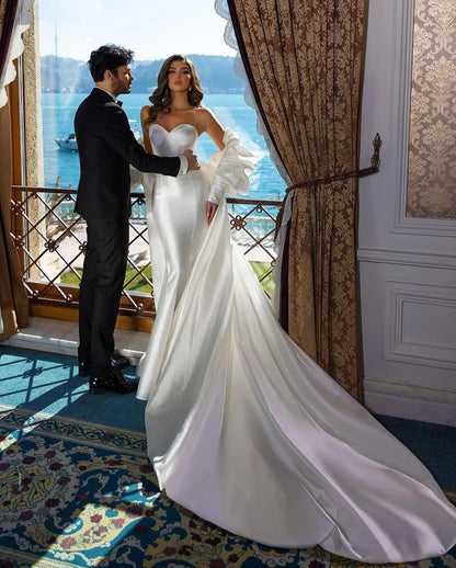 Sleek and sexy mermaid gown made of smooth satin with luxury bridal vibes.