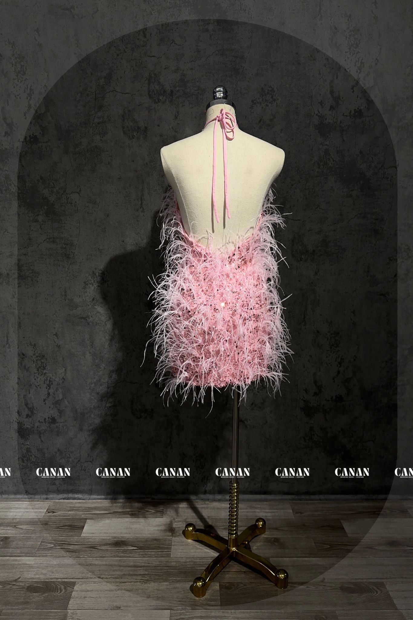 Short Pink Dress with Feather Accents for a Whimsical Touch