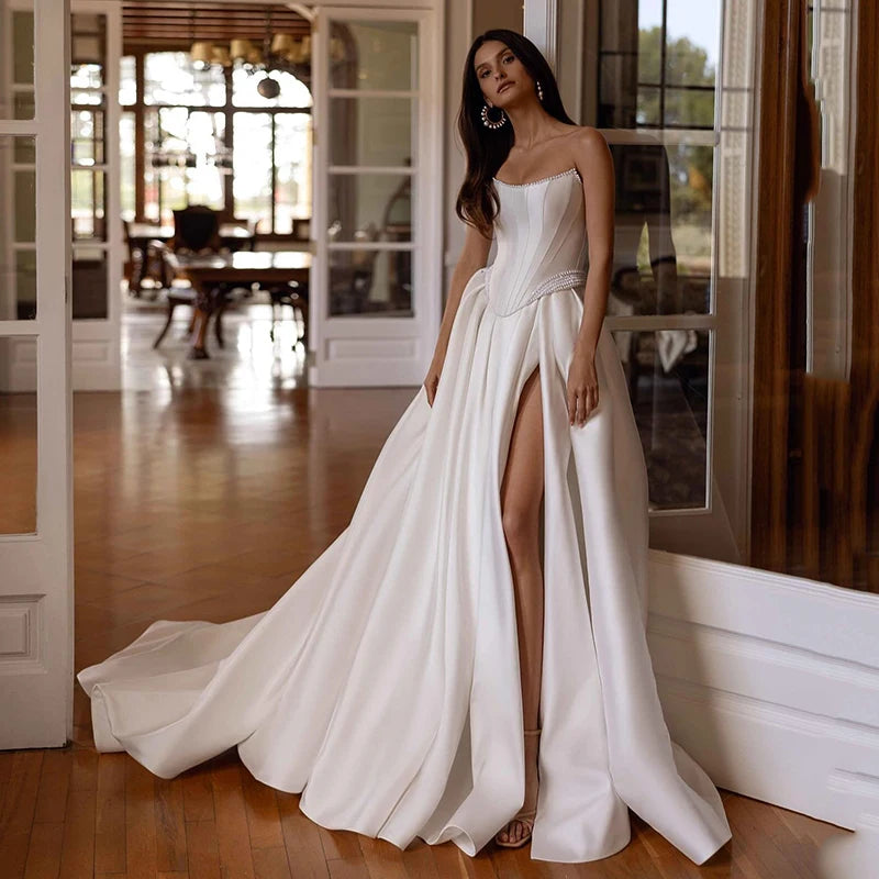 Satin strapless A-line wedding dress with clean corset bodice and long train