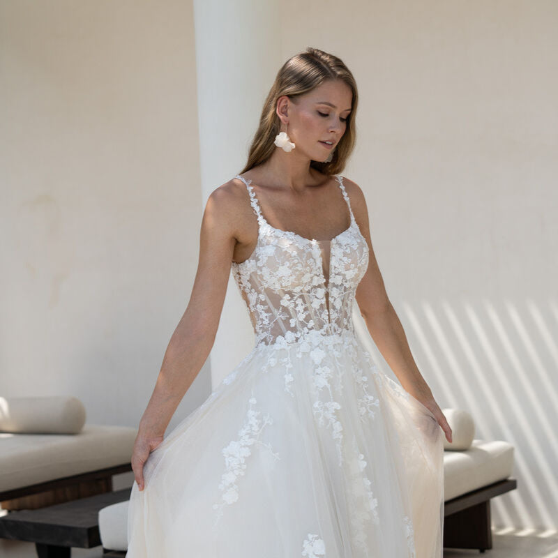 Lightweight A-line wedding gown ideal for beach or destination weddings, with airy tulle and delicate lace straps.