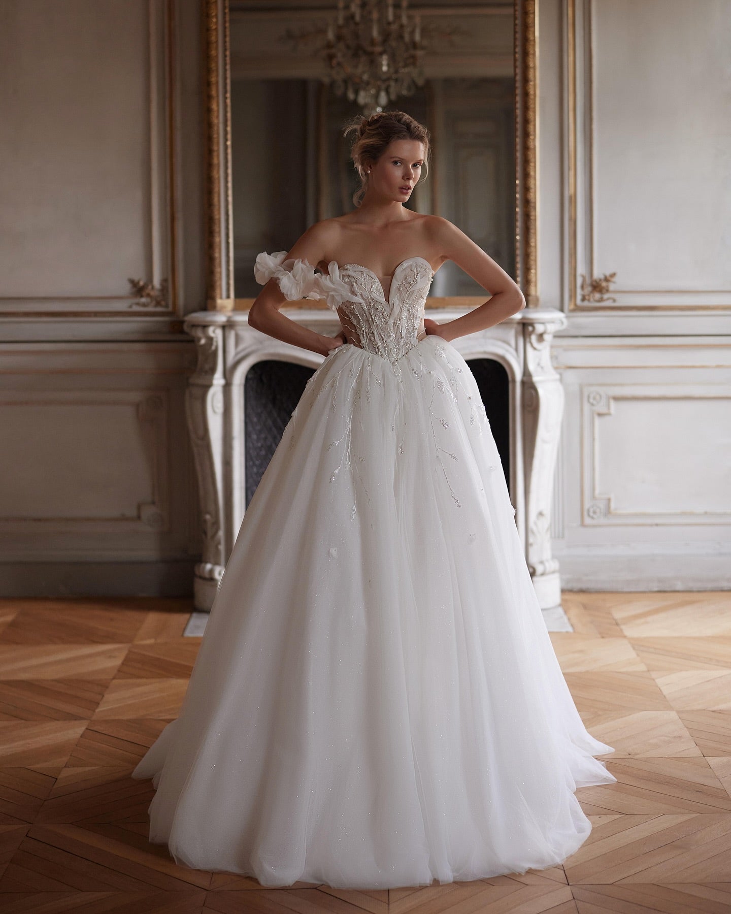 Sweetheart neckline ball gown with sheer corset bodice and sparkling tulle skirt