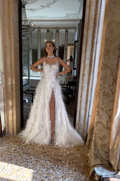 Side slit detail on feather embellished tulle wedding dress