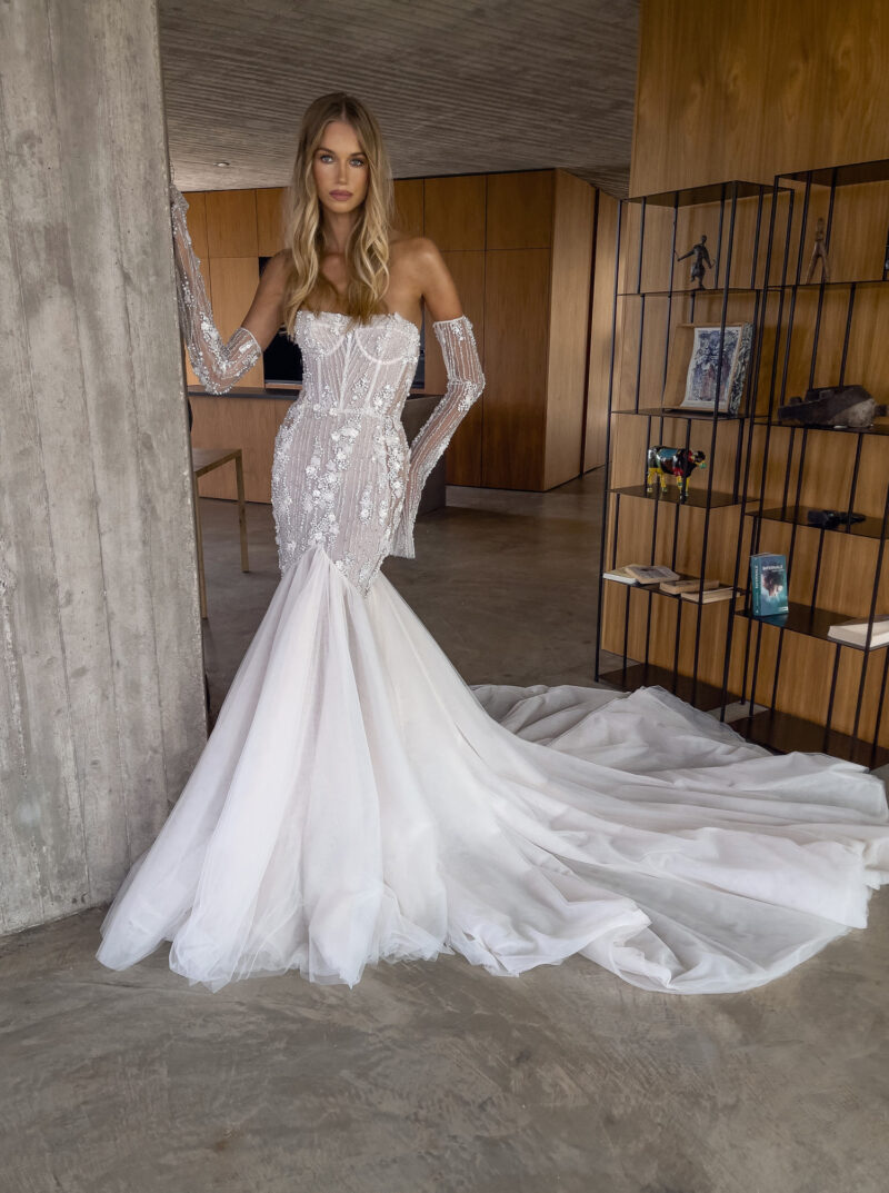 modern bridal gown with sheer corset and flared skirt