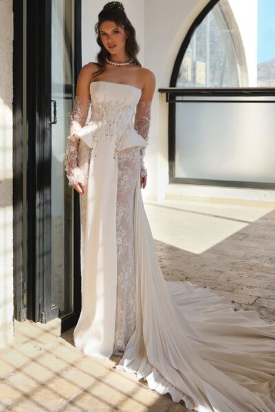 crepe corset wedding dress with flowing train and lace detailing
