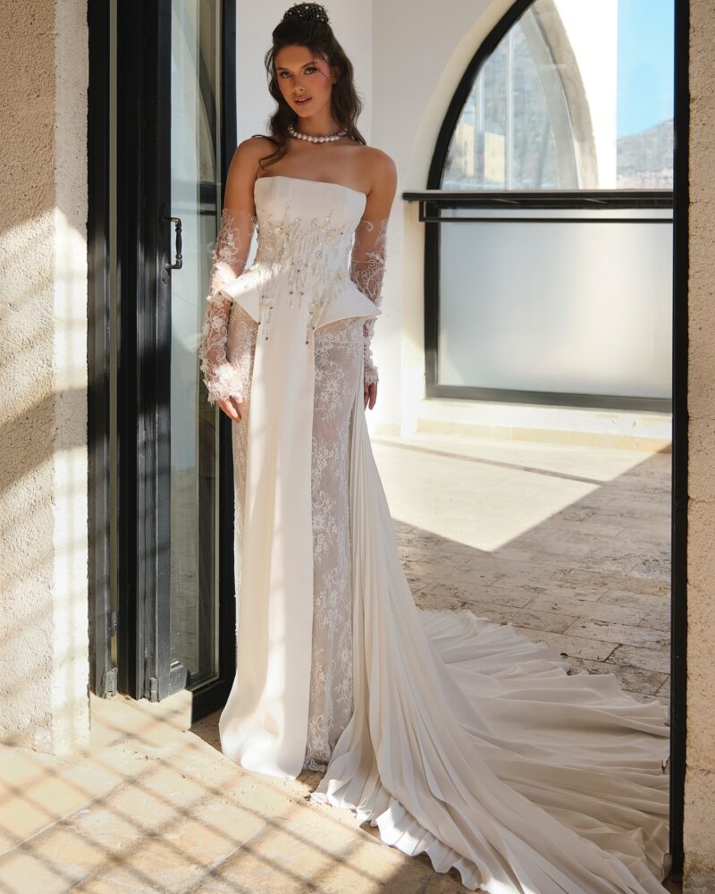 crepe corset wedding dress with flowing train and lace detailing