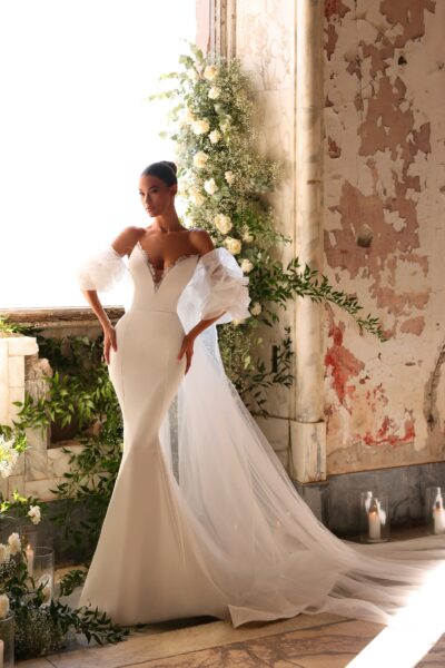 crepe mermaid wedding dress with detachable tulle sleeves and cathedral train