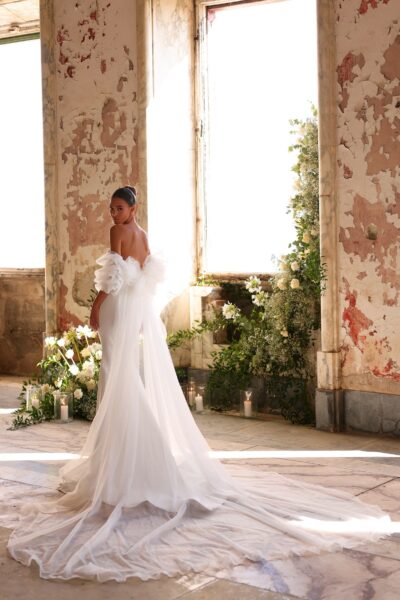 crepe mermaid wedding dress with lace-trim V neckline and puff tulle sleeves