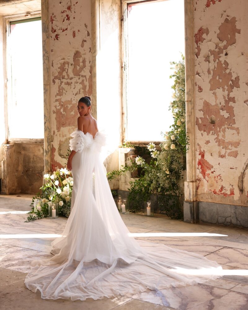 crepe mermaid wedding dress with lace-trim V neckline and puff tulle sleeves