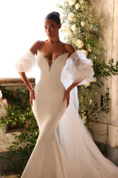 crepe mermaid wedding dress with deep V neckline and cathedral train
