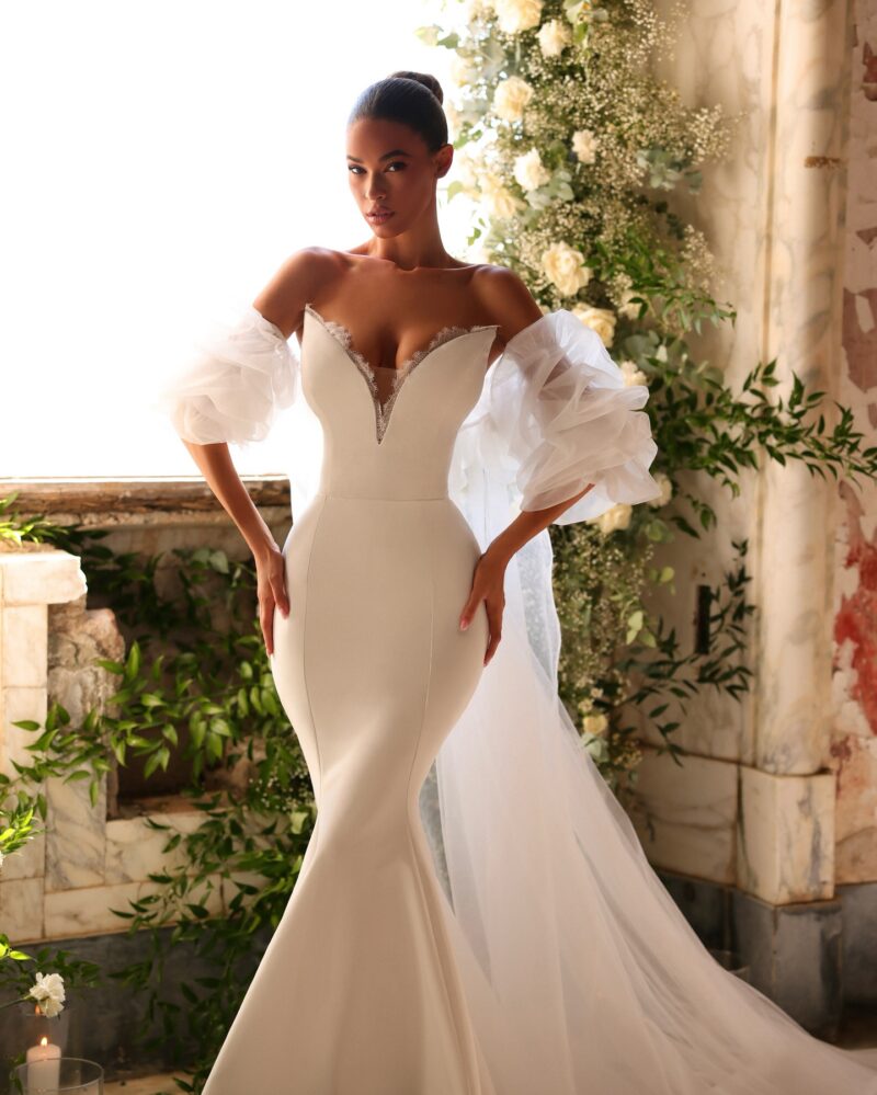 crepe mermaid wedding dress with deep V neckline and cathedral train