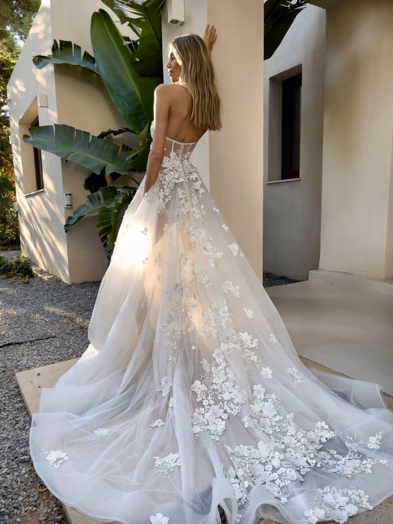 back view of floral tulle wedding gown with long train