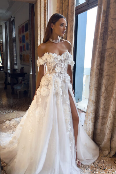 Close-up of floral corset and tulle slit skirt