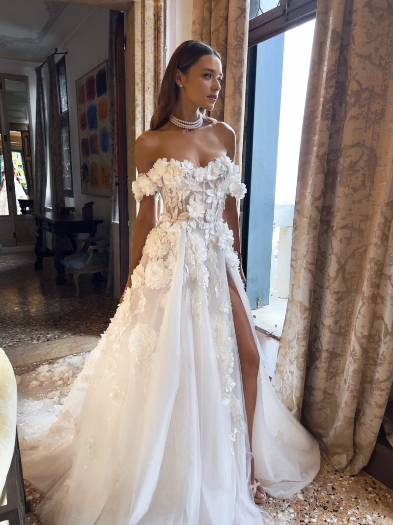 Close-up of floral corset and tulle slit skirt